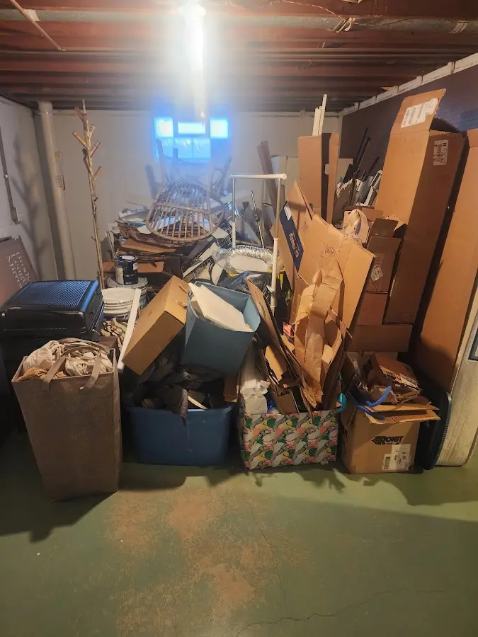 Roll-off dumpster container at job site for 8 Yard Dumpster Rental in Williston Park